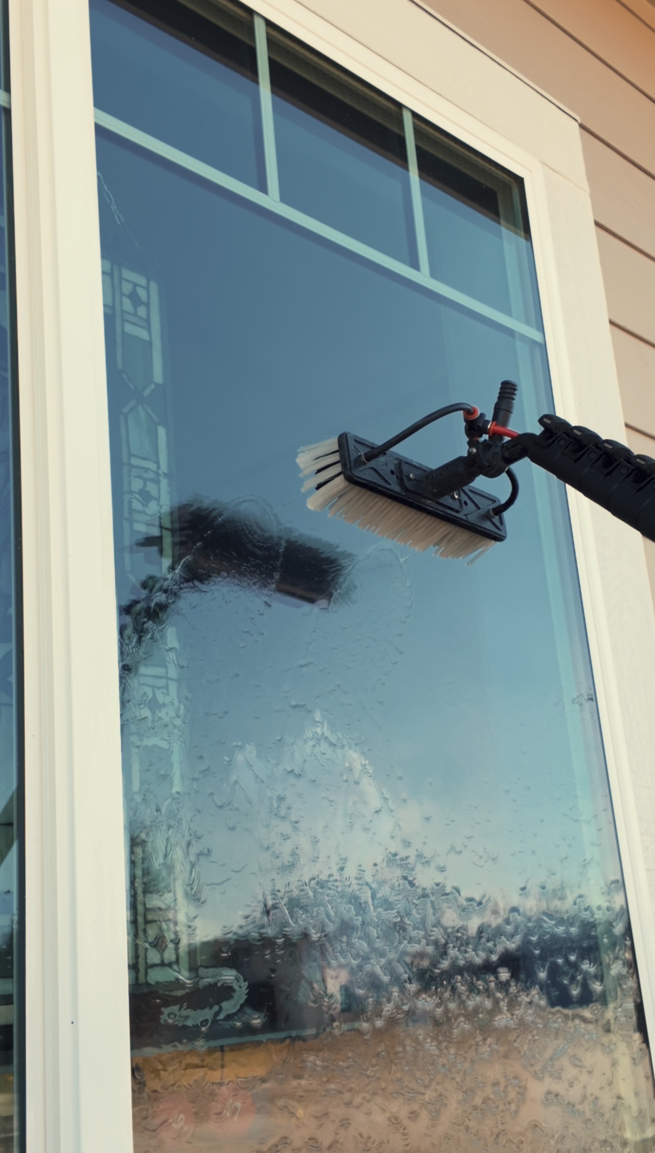 Rinse — exterior window cleaning step